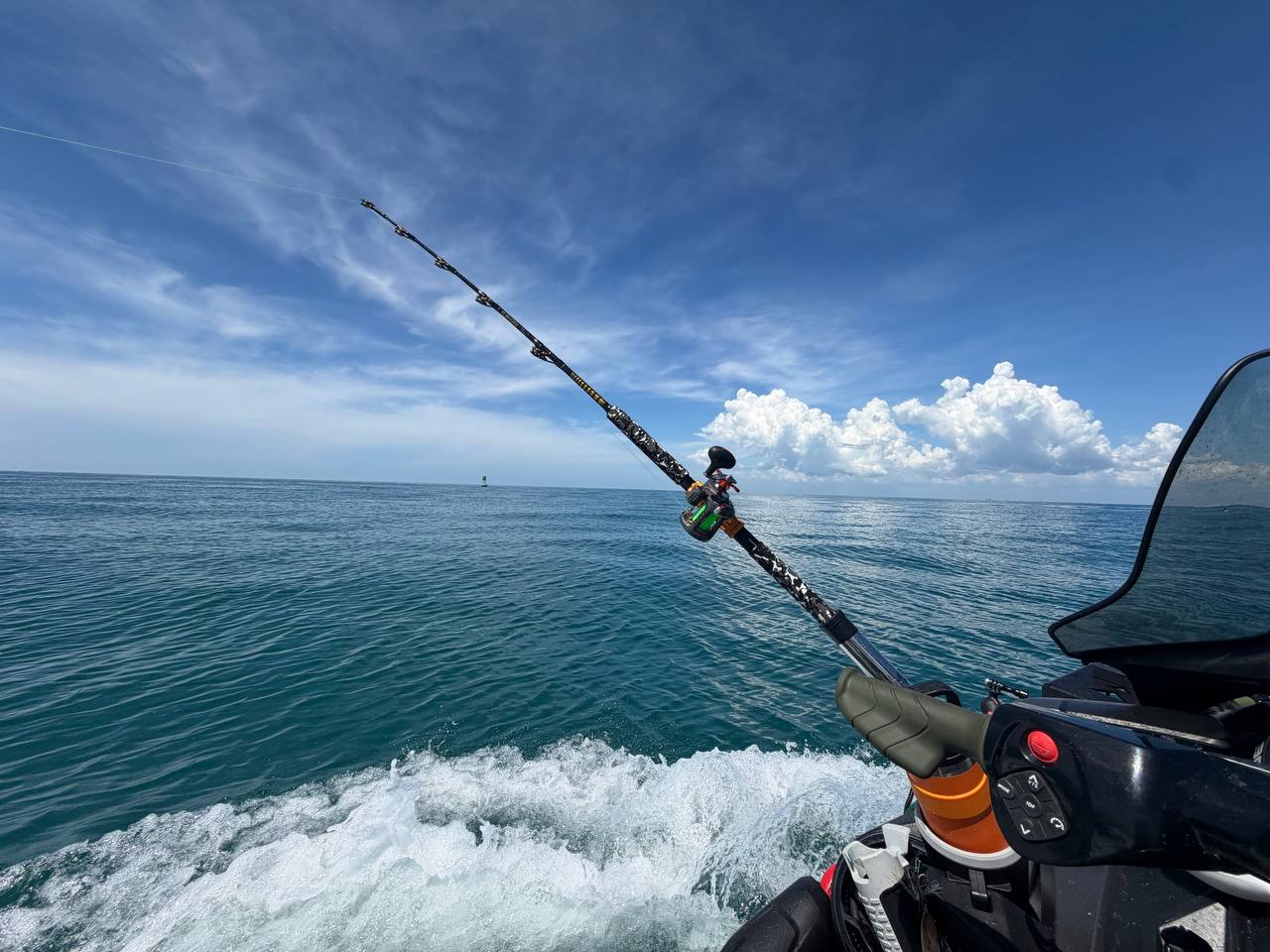 Rod over open water from the moving craft