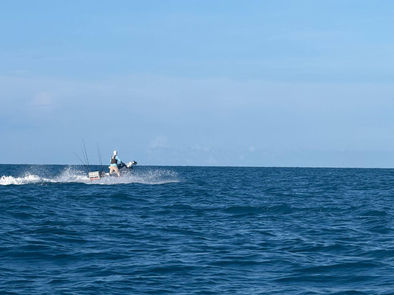 Solo angler across open water