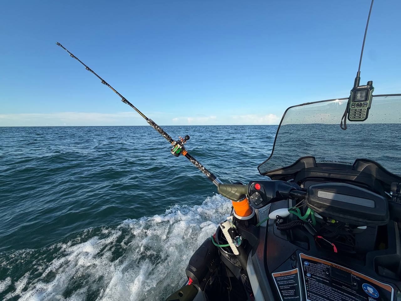 Rod, radio, and boat controls while underway